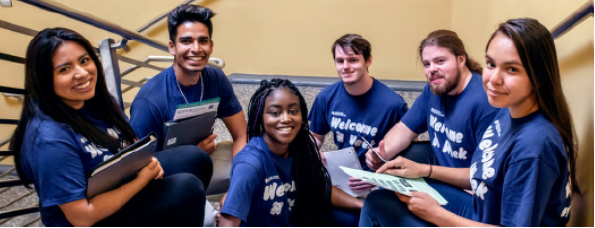 group of students sitting in stairwell